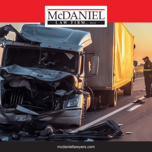 After a tractor-trailer collision on the highway in Jonesboro, the truck driver surveys the damage